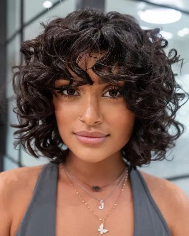 Long, curly bangs for diamond-shaped face